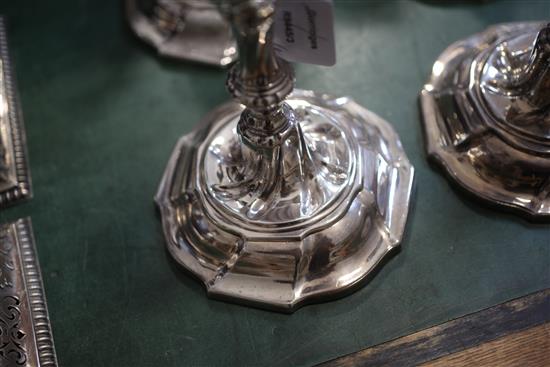 A matched set of four late 18th century silver candlesticks, engraved with the Heneage family crest,